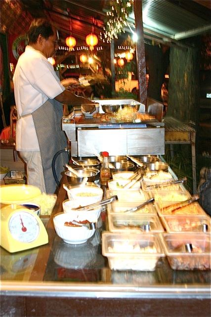 Buffet of various meats, veggies, condiments & sauces
